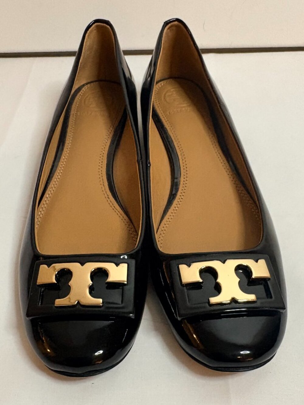 Black Patent Women's Ballet Flats with Gold Emblem